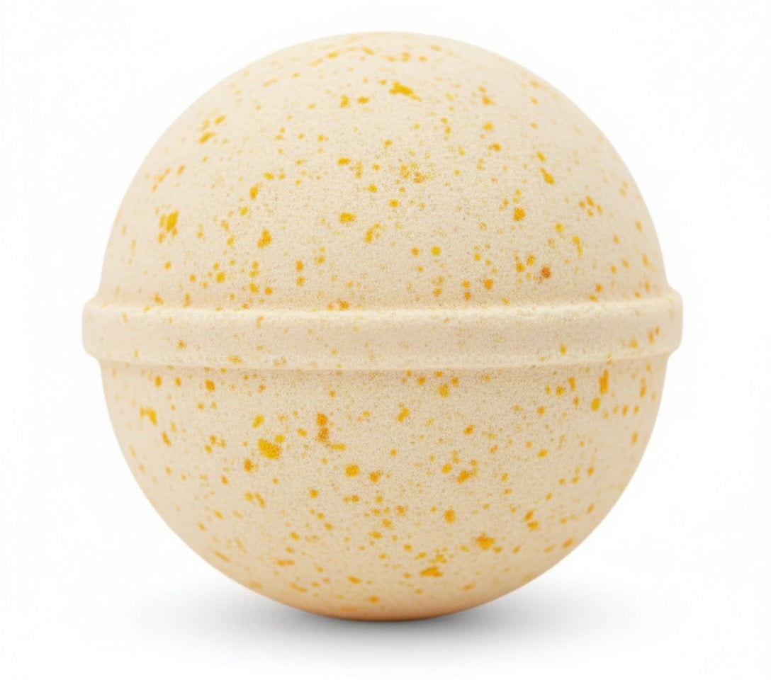 Beige bath bomb with speckled pattern on a white background