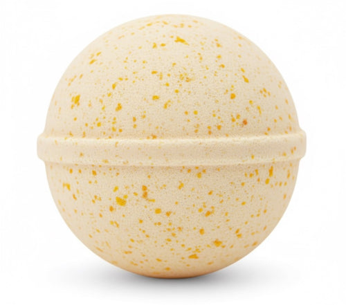 Beige bath bomb with speckled pattern on a white background